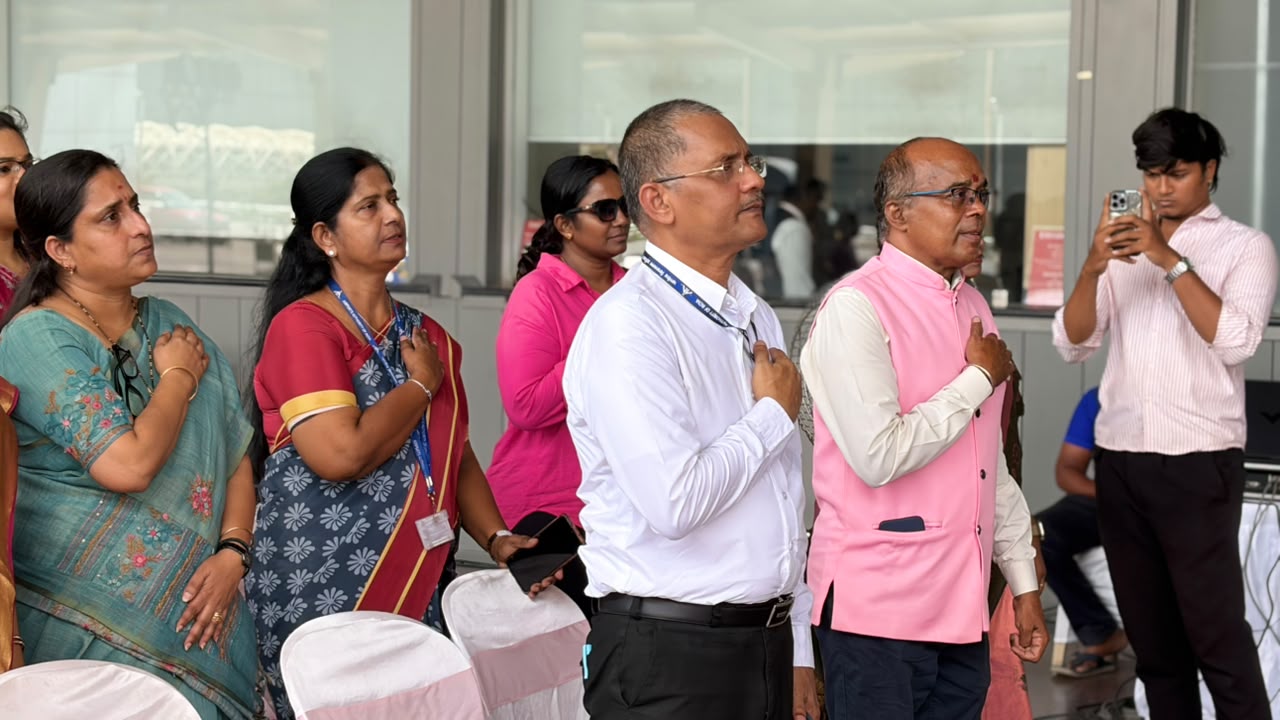 Guests stand with hands over hearts as the inauguration opens.